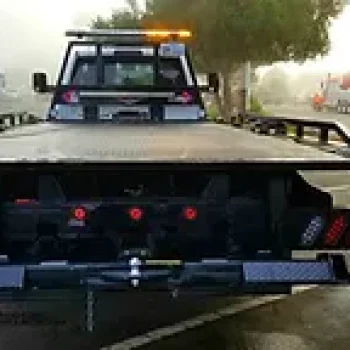 Flatbed-Tow-Truck-on-Interstate-Near-Charlotte-NC-During-Morning-Rush-Hour