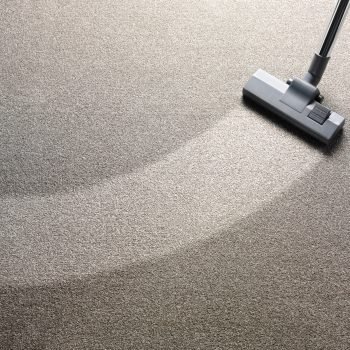 Vacuum cleaner on a carpet with an extra clean strip