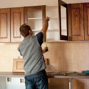carpenter-installing-cabinets